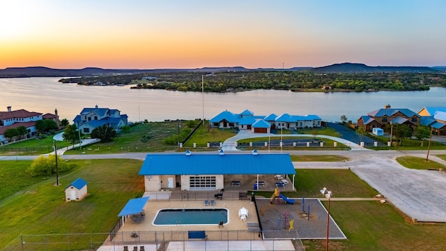 2040 Bluff Creek Dr, Strawn, TX 76475 - aerial view at dusk featuring a water and mountain view