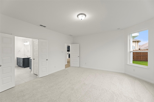 5038 Duck Cove Cir, Royse City, TX 75189 - unfurnished bedroom with baseboards, light carpet, and ensuite bath