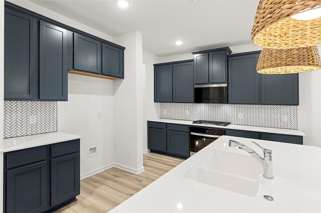 5038 Duck Cove Cir, Royse City, TX 75189 - kitchen with stainless steel appliances, tasteful backsplash, recessed lighting, light countertops, and light wood-style floors