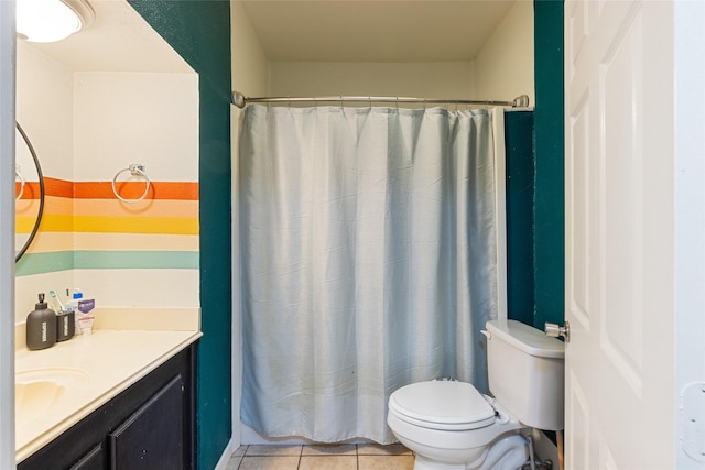 bathroom with vanity, a shower with curtain, toilet, and tile patterned floors