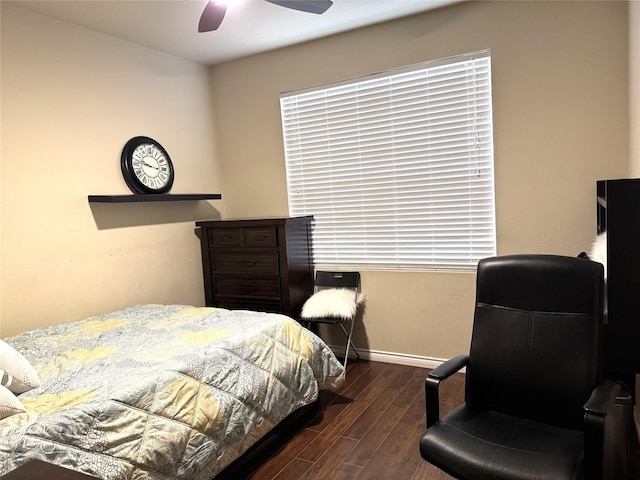 bedroom featuring dark wood-style floors, baseboards, and a ceiling fan