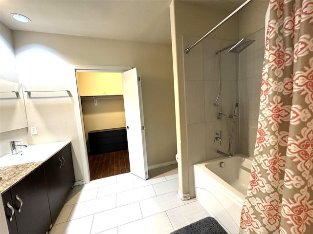 full bathroom featuring baseboards, toilet, shower / tub combo with curtain, tile patterned floors, and vanity