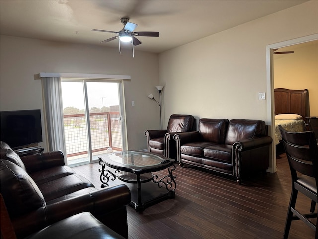 living room with ceiling fan and wood finished floors