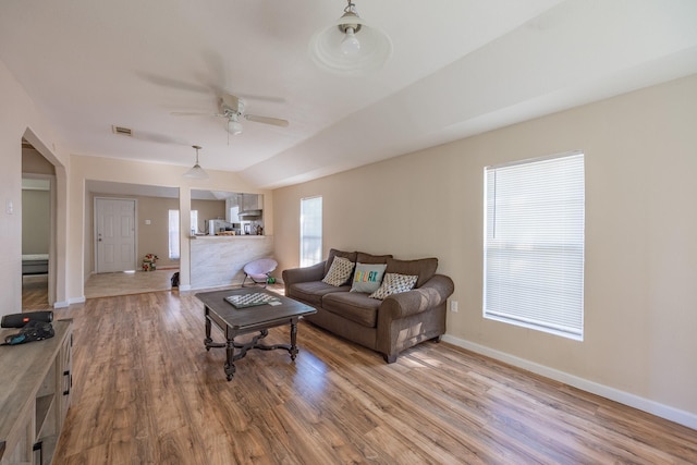 living room with hardwood / wood-style flooring and ceiling fan