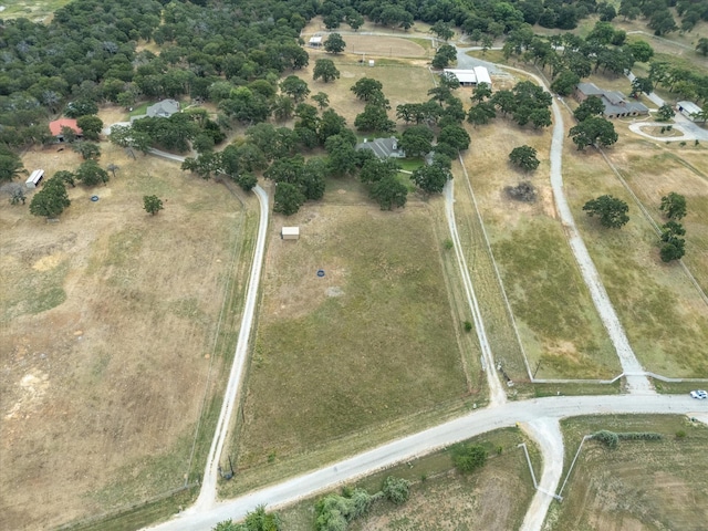 birds eye view of property with a rural view