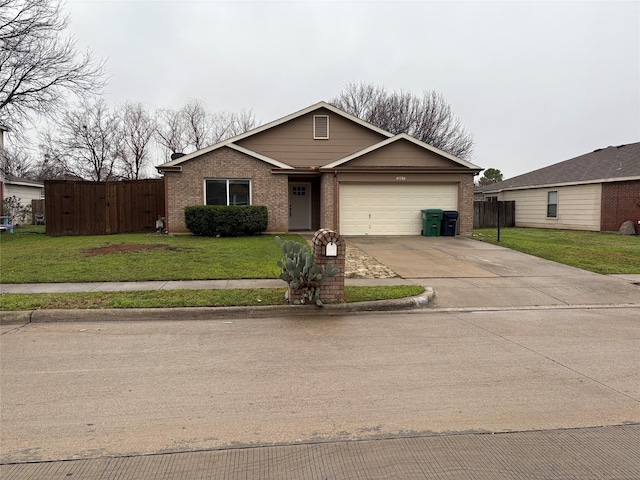 view of front of property with a garage and a front yard