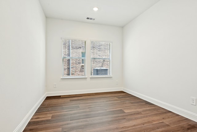 2321 Wellington Ln, Corinth, TX 76210 - empty room with dark wood-type flooring, baseboards, and recessed lighting