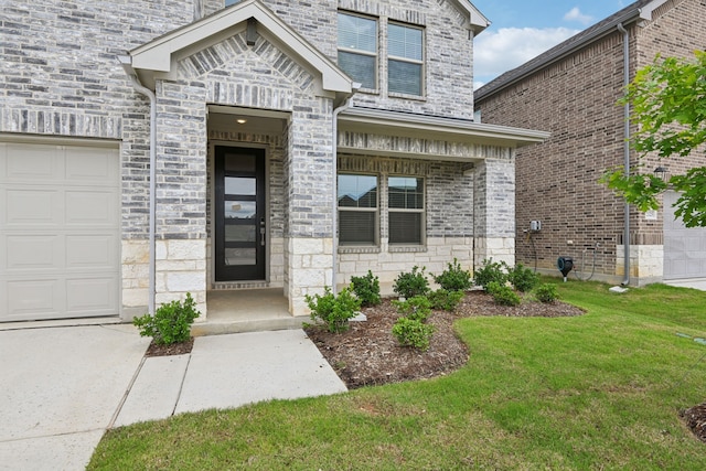 2321 Wellington Ln, Corinth, TX 76210 - view of exterior entry featuring a lawn and stone siding