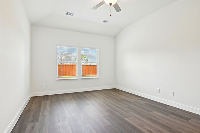 2321 Wellington Ln, Corinth, TX 76210 - empty room with dark wood-type flooring, lofted ceiling, a ceiling fan, and baseboards