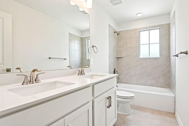 2321 Wellington Ln, Corinth, TX 76210 - full bathroom featuring toilet, shower / washtub combination, tile patterned floors, and double vanity