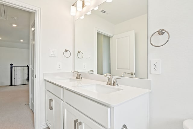 2321 Wellington Ln, Corinth, TX 76210 - bathroom with double vanity and recessed lighting
