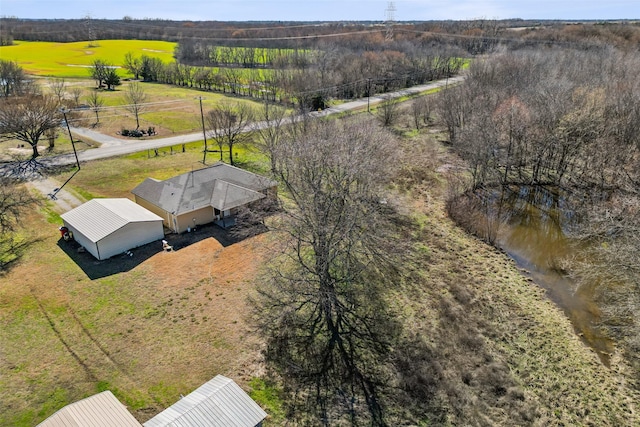 birds eye view of property with a rural view