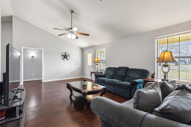 living area with a ceiling fan, a healthy amount of sunlight, vaulted ceiling, and wood finished floors