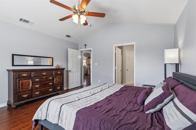 bedroom with dark wood-style floors, ceiling fan, visible vents, and vaulted ceiling