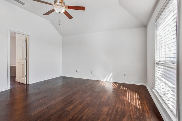 empty room featuring ceiling fan, lofted ceiling, and dark hardwood / wood-style flooring