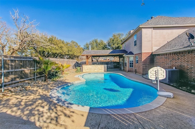 view of pool featuring central AC unit, a patio, and a gazebo