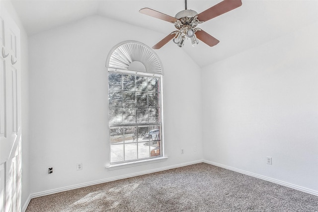 carpeted empty room with ceiling fan and lofted ceiling