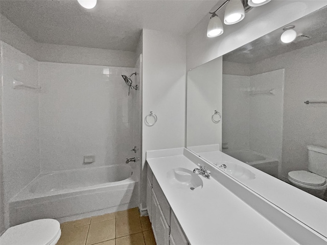 full bathroom featuring vanity, tiled shower / bath, toilet, and tile patterned floors