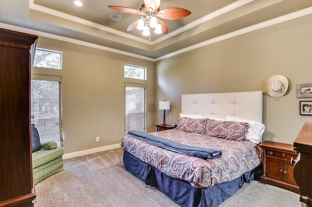 carpeted bedroom with a raised ceiling, ceiling fan, crown molding, and access to exterior