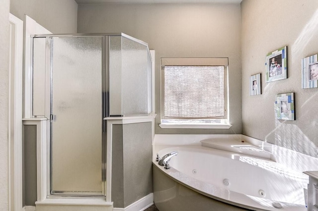 bathroom with separate shower and tub