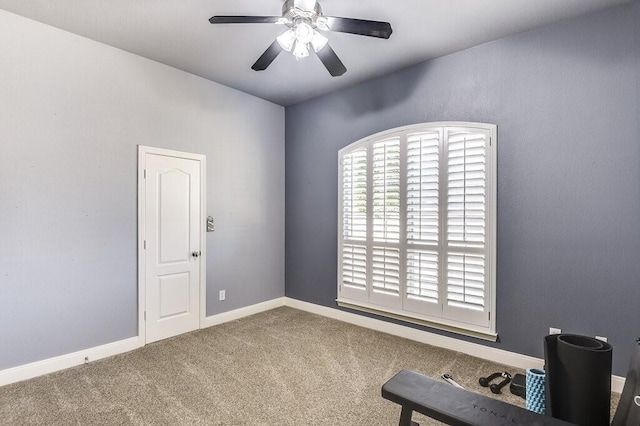 interior space featuring ceiling fan and carpet flooring