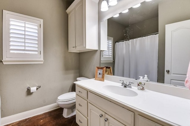 bathroom with vanity, a shower with curtain, and toilet