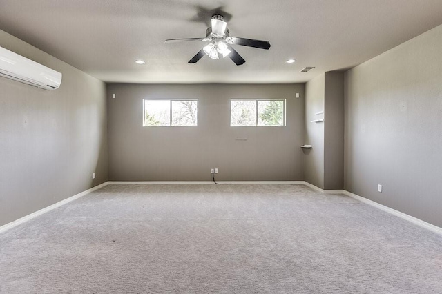 carpeted empty room with ceiling fan and an AC wall unit