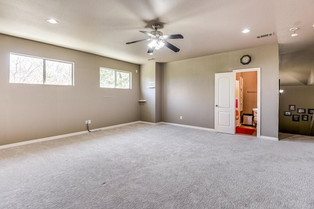 unfurnished room featuring ceiling fan and light carpet