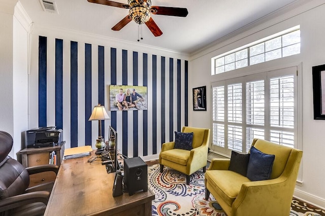 sitting room featuring ceiling fan and crown molding