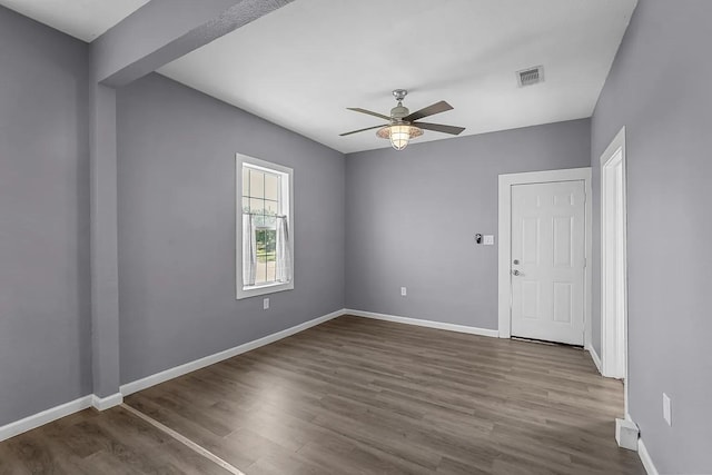 unfurnished room with ceiling fan and wood-type flooring