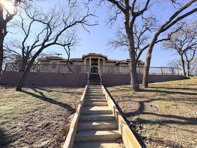 view of front of home featuring a tile roof