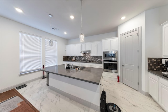 kitchen with sink, white cabinetry, stainless steel appliances, and pendant lighting