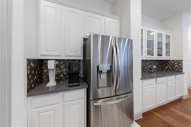 kitchen with white cabinetry, backsplash, stainless steel fridge with ice dispenser, and dark hardwood / wood-style flooring