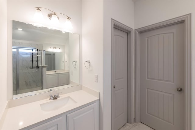 bathroom featuring vanity and a shower with door