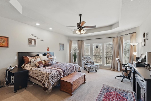 bedroom featuring light colored carpet, a ceiling fan, and recessed lighting