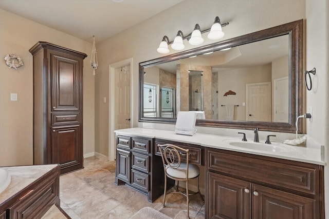 full bathroom with a tile shower and vanity