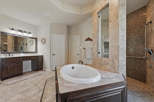 bathroom featuring a tile shower, vanity, and a whirlpool tub
