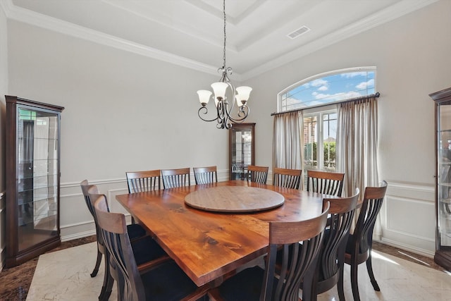 dining area with a decorative wall, marble finish floor, and ornamental molding