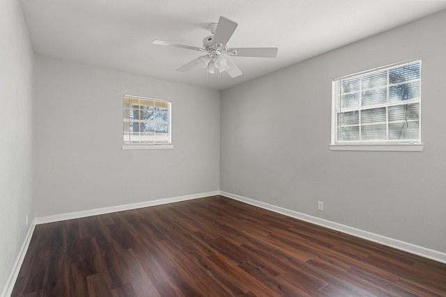 unfurnished room with ceiling fan and dark hardwood / wood-style floors