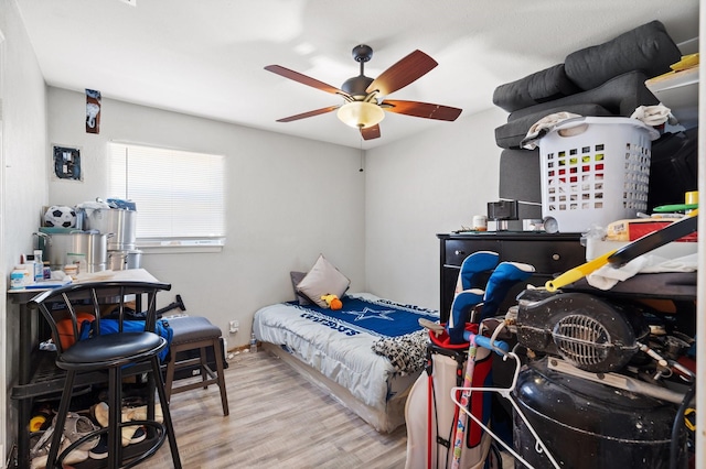 bedroom featuring ceiling fan and light hardwood / wood-style floors