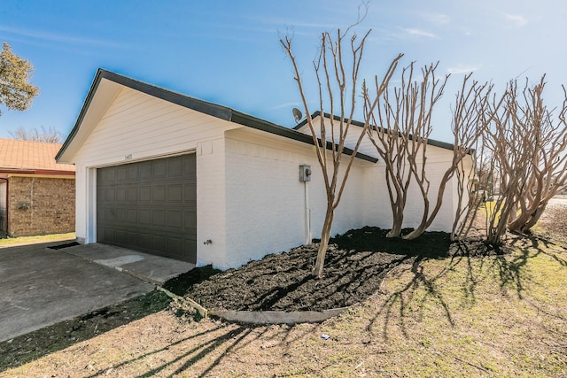 view of side of property featuring a garage