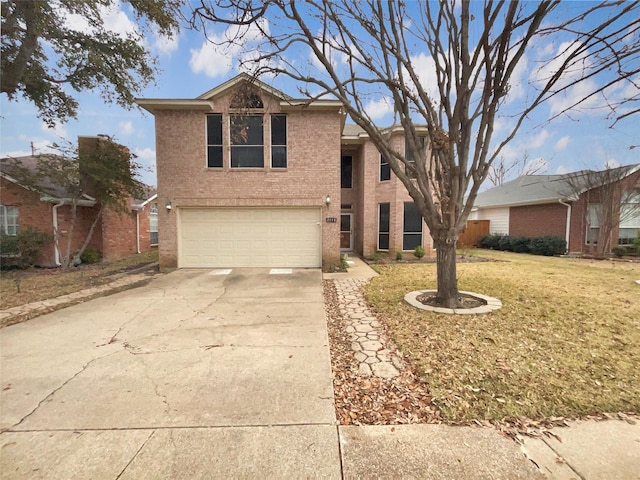 traditional home with a garage, driveway, brick siding, and a front yard