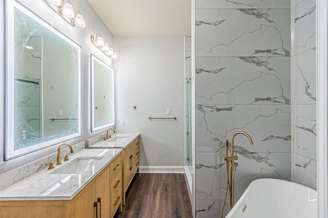 bathroom with vanity, shower with separate bathtub, and wood-type flooring