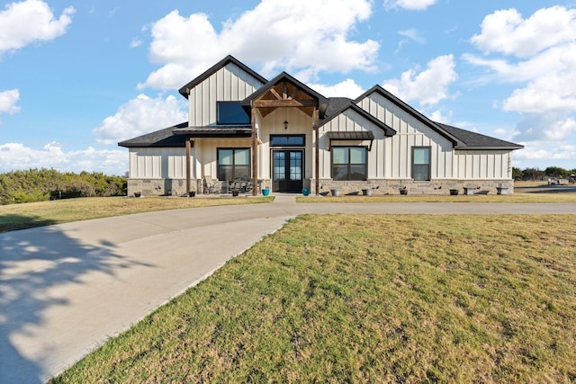 modern farmhouse with a front lawn