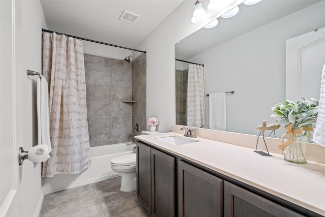 full bathroom with tile patterned floors, vanity, shower / tub combo with curtain, and toilet