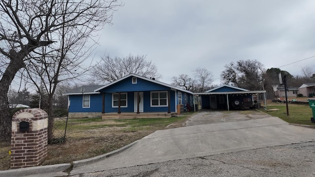 view of front of property with covered porch and a carport