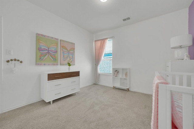 bedroom featuring light carpet, visible vents, and baseboards