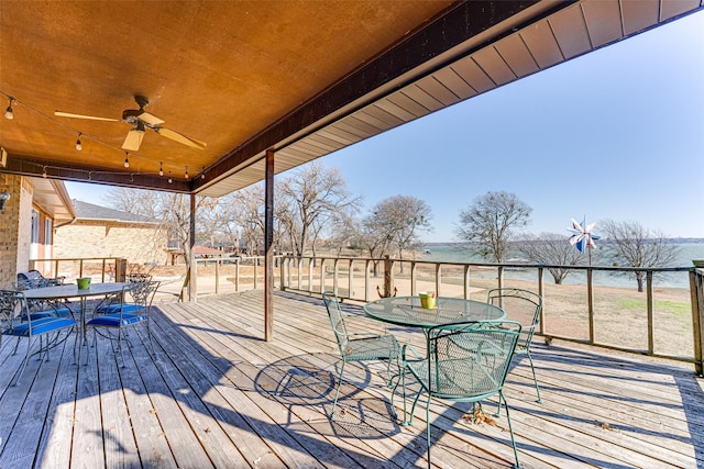 wooden deck featuring ceiling fan