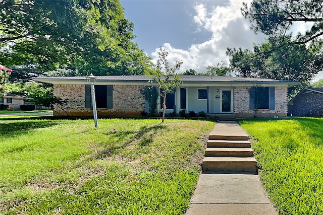 ranch-style home with a front yard