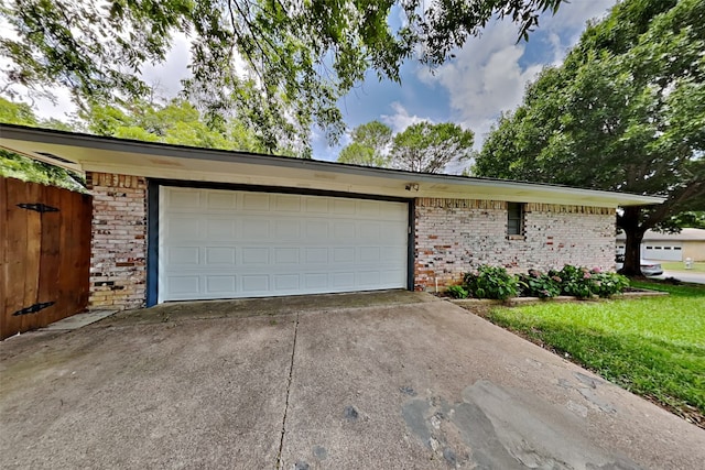 garage featuring a lawn